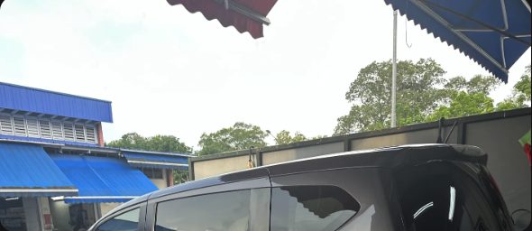 Customer's car parked near a market, photo from zhensheng.ang's Google review